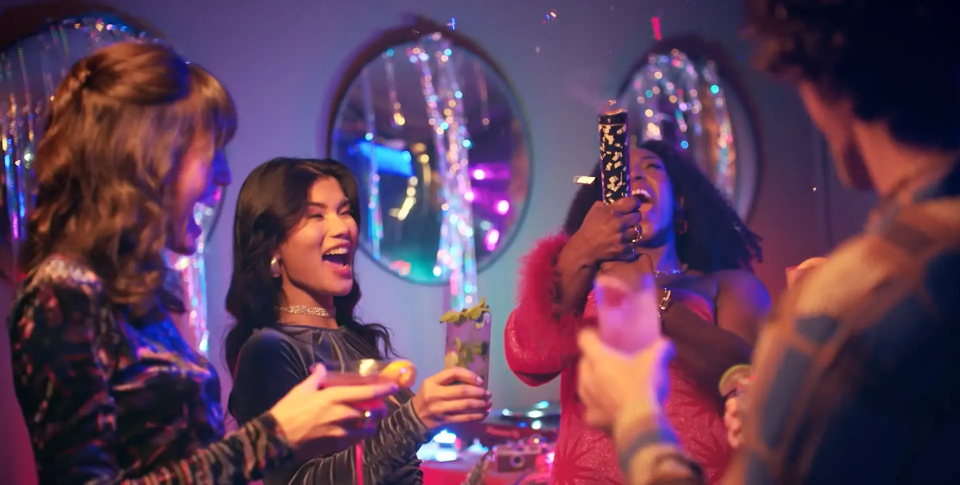 Guests celebrating with cocktails at a brand event